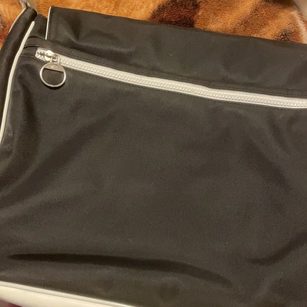 Lacoste Black Messenger Bag with White Trim and Green Logo